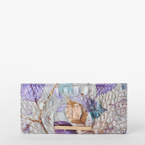 BRAHMIN Ady Wallet in Frosted Melbourne with an embossed textured pattern, elegant gold and purple leaf accents, metallic Brahmin nameplate at the bottom, slim rectangular silhouette, front view.