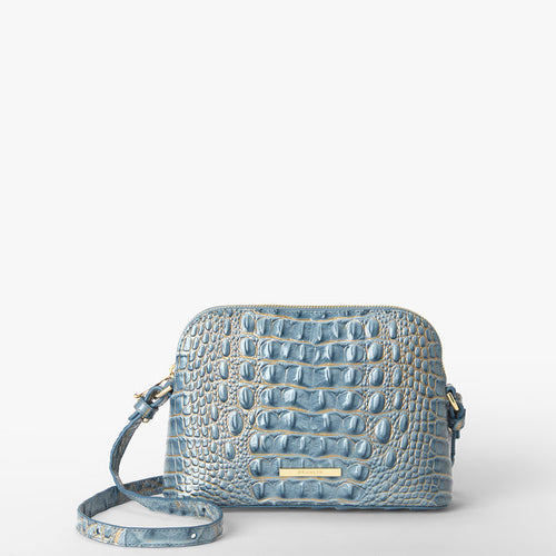 A light blue crocodile-embossed leather handbag with a matching shoulder strap and gold-tone hardware, photographed on a clean white background.