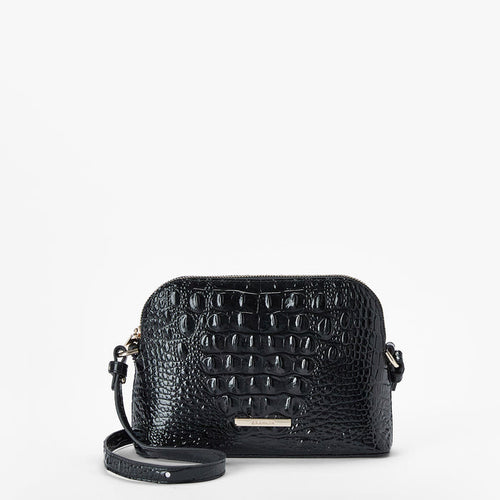 The Amal is a small black crossbody bag crafted from genuine leather with a textured, croc-embossed pattern, gold hardware, and a detachable strap, displayed against a plain white background.