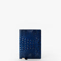 A Journal in navy blue with crocodile texture and gold corner details stands upright against a plain white background, highlighting the refined elegance reminiscent of classic leather Melbourne journals.